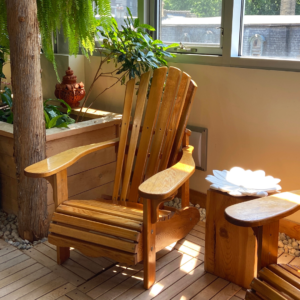 Wooden chair with armrest in the waiting area at Elmspa